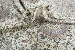 Surface texture of 2000s Kashan rug with natural Wool and intricate pattern