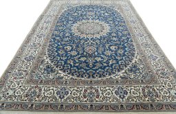 Surface texture of 2000s Nain rug with natural Wool and intricate pattern