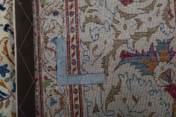 Surface texture of 1950s Kashan rug with natural Wool and intricate pattern