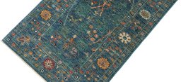 Backside of handmade New Farahan rug showing knot structure and weave density