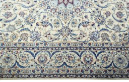 Corner detail of 2000s Nain rug showing border pattern and Wool pile