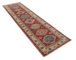 Corner detail of New Kazak rug showing border pattern and Wool pile