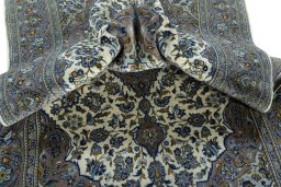 Surface texture of 2000s Kashan rug with natural Wool and intricate pattern
