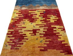 Surface texture of 2000s Persian Gabbeh rug with natural Wool and intricate pattern