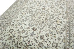 Backside of handmade 2000s Kashan rug showing knot structure and weave density