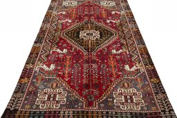 Surface texture of 2000s Shiraz rug with natural Wool and intricate pattern