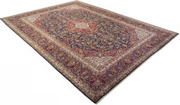 Close-up detail of 2000s Kashan rug from Iran / Persia showing Wool weave