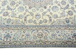 Corner detail of 2000s Nain rug showing border pattern and Wool pile