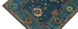 Backside of handmade New Farahan rug showing knot structure and weave density