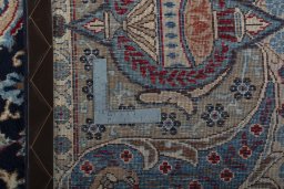 Backside of handmade 1970s Kashmar rug showing knot structure and weave density
