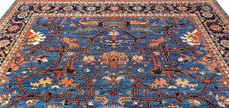 Backside of handmade New Farahan rug showing knot structure and weave density