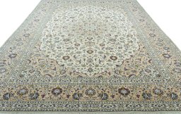 Surface texture of 2000s Kashan rug with natural Wool and intricate pattern