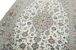 Backside of handmade 2000s Kashan rug showing knot structure and weave density