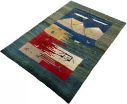 Corner detail of 2000s Persian Gabbeh rug showing border pattern and Wool pile