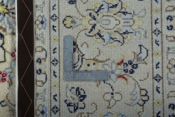 Backside of handmade 2000s Kashan rug showing knot structure and weave density