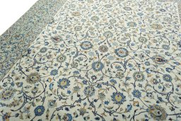 Backside of handmade 2000s Kashan rug showing knot structure and weave density