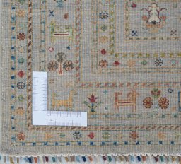 Corner detail of New Samarkand rug showing border pattern and Wool pile