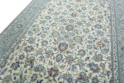Backside of handmade 2000s Kashan rug showing knot structure and weave density