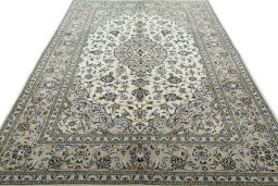 Surface texture of 2000s Kashan rug with natural Wool and intricate pattern