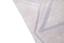 Backside of handmade New Mahli rug showing knot structure and weave density
