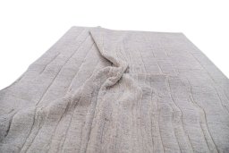Backside of handmade New Mahli rug showing knot structure and weave density