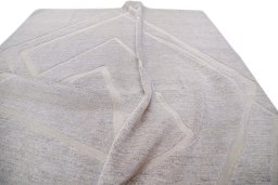Backside of handmade New Mahli rug showing knot structure and weave density