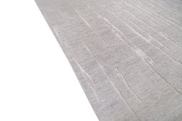 Backside of handmade New Mahli rug showing knot structure and weave density