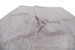 Backside of handmade New Mahli rug showing knot structure and weave density
