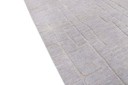 Backside of handmade New Mahli rug showing knot structure and weave density