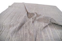 Backside of handmade New Mahli rug showing knot structure and weave density