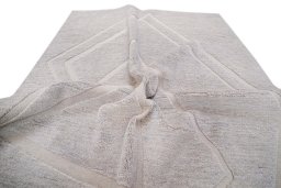 Backside of handmade New Mahli rug showing knot structure and weave density