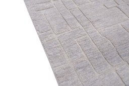 Backside of handmade New Mahli rug showing knot structure and weave density