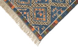Backside of handmade New Morocco rug showing knot structure and weave density