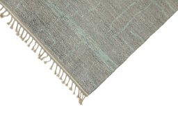 Backside of handmade New Morocco rug showing knot structure and weave density