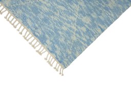 Backside of handmade New Morocco rug showing knot structure and weave density