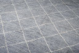Backside of handmade New Morocco rug showing knot structure and weave density