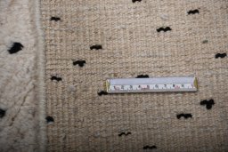 Backside of handmade New Morocco rug showing knot structure and weave density