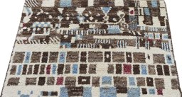 Backside of handmade New Morocco rug showing knot structure and weave density