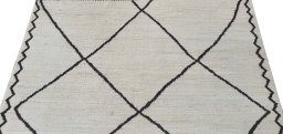 Backside of handmade New Morocco rug showing knot structure and weave density