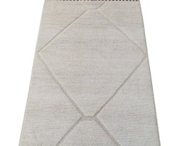 Backside of handmade New Morocco rug showing knot structure and weave density