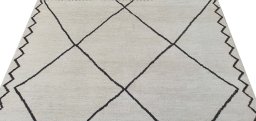 Backside of handmade New Morocco rug showing knot structure and weave density