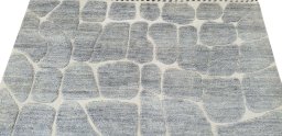 Backside of handmade New Morocco rug showing knot structure and weave density