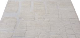 Backside of handmade New Morocco rug showing knot structure and weave density