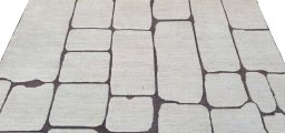 Backside of handmade New Morocco rug showing knot structure and weave density
