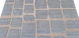 Backside of handmade New Morocco rug showing knot structure and weave density