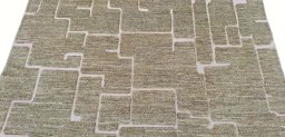 Backside of handmade New Morocco rug showing knot structure and weave density