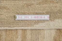 Full view of New Nepal Carpets rug from Nepal, 274 × 183 cm in Cream tones