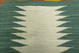 Backside of handmade New Kilim Dastan rug showing knot structure and weave density