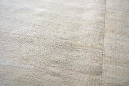 Backside of handmade New Kilim Kiasar rug showing knot structure and weave density
