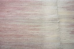 Backside of handmade New Kilim Kiasar rug showing knot structure and weave density